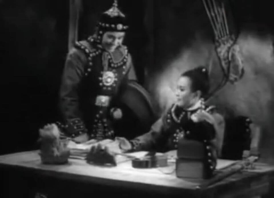 Mulan and Yuandu discussing military plans in the 1939 film Mulan Joins the Army. ©1939 China United Productions.